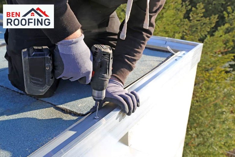 Technician fixing damage on a flat roof.